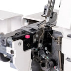 Janome MyLock 454D serger machine internals; white exterior with metal threading and needle mechanism.