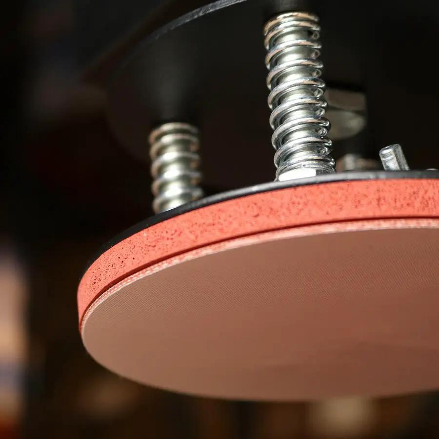 Ricoma plate heat press HP-08P/HP-10P close-up with red circular heating plate and chrome springs visible