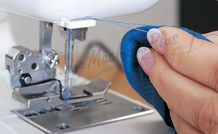 Janome 1000CPX Cover Pro coverstitch machine, refurbished, sewing blue fabric