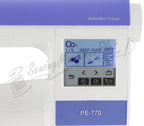Refurbished Brother PE-770 embroidery machine with white body and purple top panel