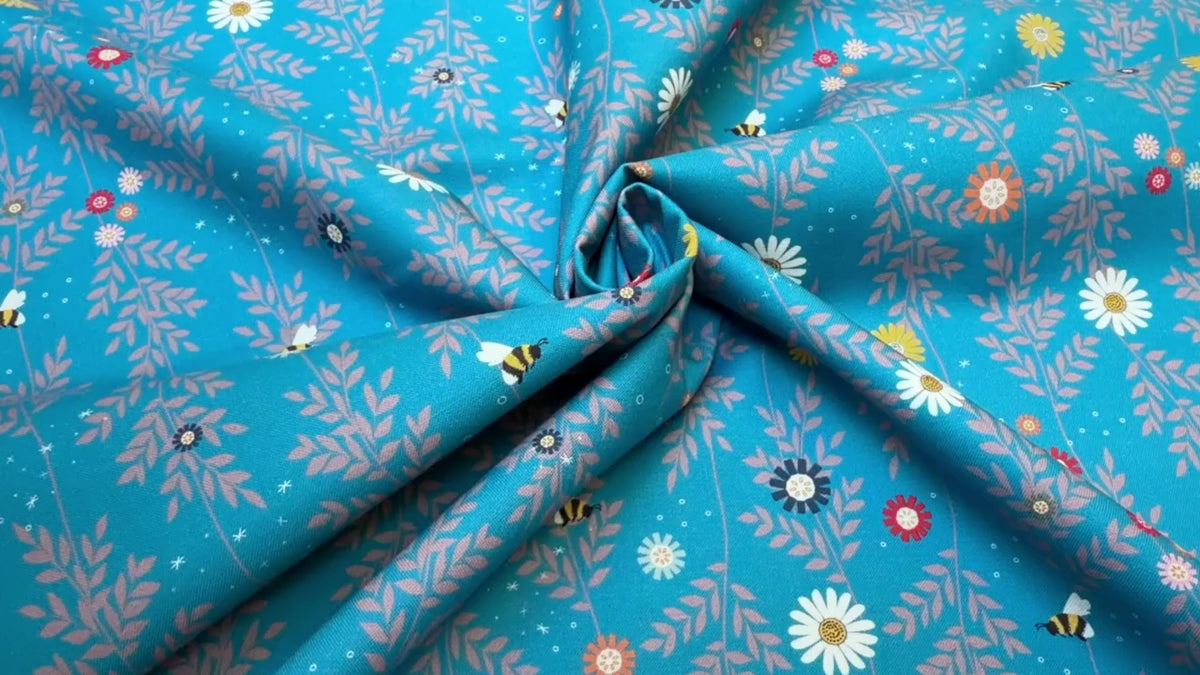 Oh Blooming Dale Turquoise quilting fabric with colorful daisy floral motifs by Sarah J Patterson for Sewing Sanctuary