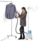 Reliable Vivio 150GC garment steamer; white unit with blue water tank steaming a blue shirt on a rolling clothing rack