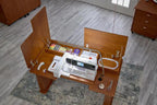 Koala Studios sewing station cabinet in teak finish, opened to reveal a Bernina sewing machine and accessories.