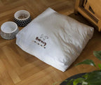 Threaders Embroidery Transfer Sheets - Pets white pillow sample with small dog embroidery and paw accents