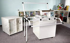DIME embroidery machine with short arm and long reach on a white stand.