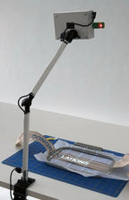 DIME Maximum View Projector on an adjustable white arm desk stand