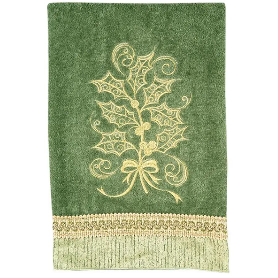 Anita Goodesign Christmas Curls 115MAGHD embroidery design on green towel with gold holly motif and lace border.