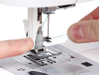 Singer Fashion Mate sewing machine (3333), white with teal thread being threaded by hands