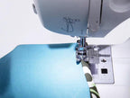 Singer Fashion Mate sewing machine with blue fabric under the presser foot