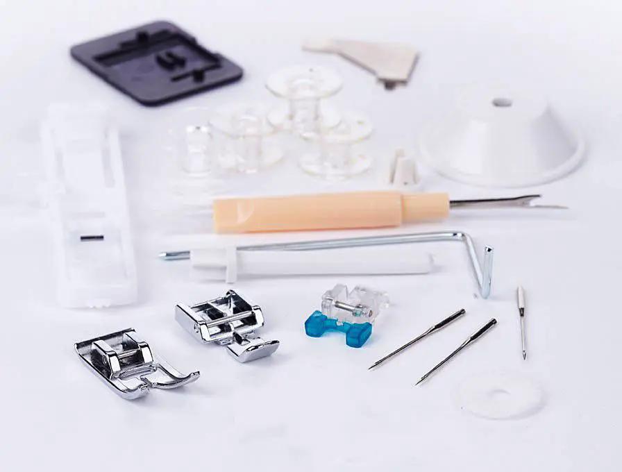 Singer Fashion Mate sewing machine accessories kit with presser feet, bobbins, needles, and small tools.