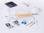 Singer Fashion Mate sewing machine accessories kit with presser feet, bobbins, needles, and small tools.