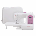 Singer Starlet sewing machine (6699) in white with pink control panel.
