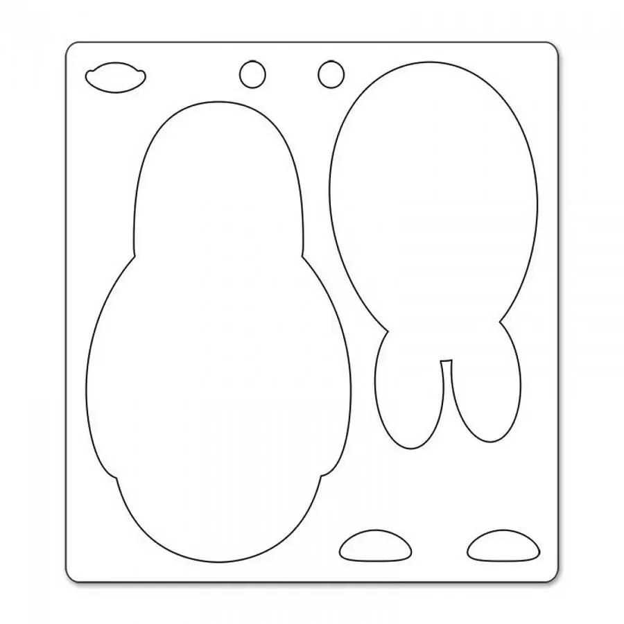 Sizzix Bigz Die Penguin by Stu Kilgour on a metal cutting plate with penguin-shaped cutouts.
