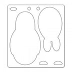 Sizzix Bigz Die Penguin by Stu Kilgour on a metal cutting plate with penguin-shaped cutouts.