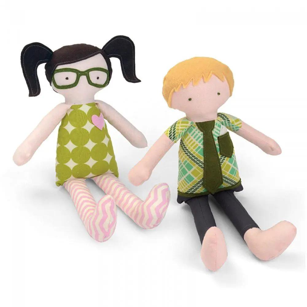 Doll plush figures: two fabric dolls in colorful outfits, one with green glasses.