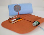 Bluefig Learn to Sew Kit fabric set with orange wrap fabric and blue fabric roll, includes thread and tools