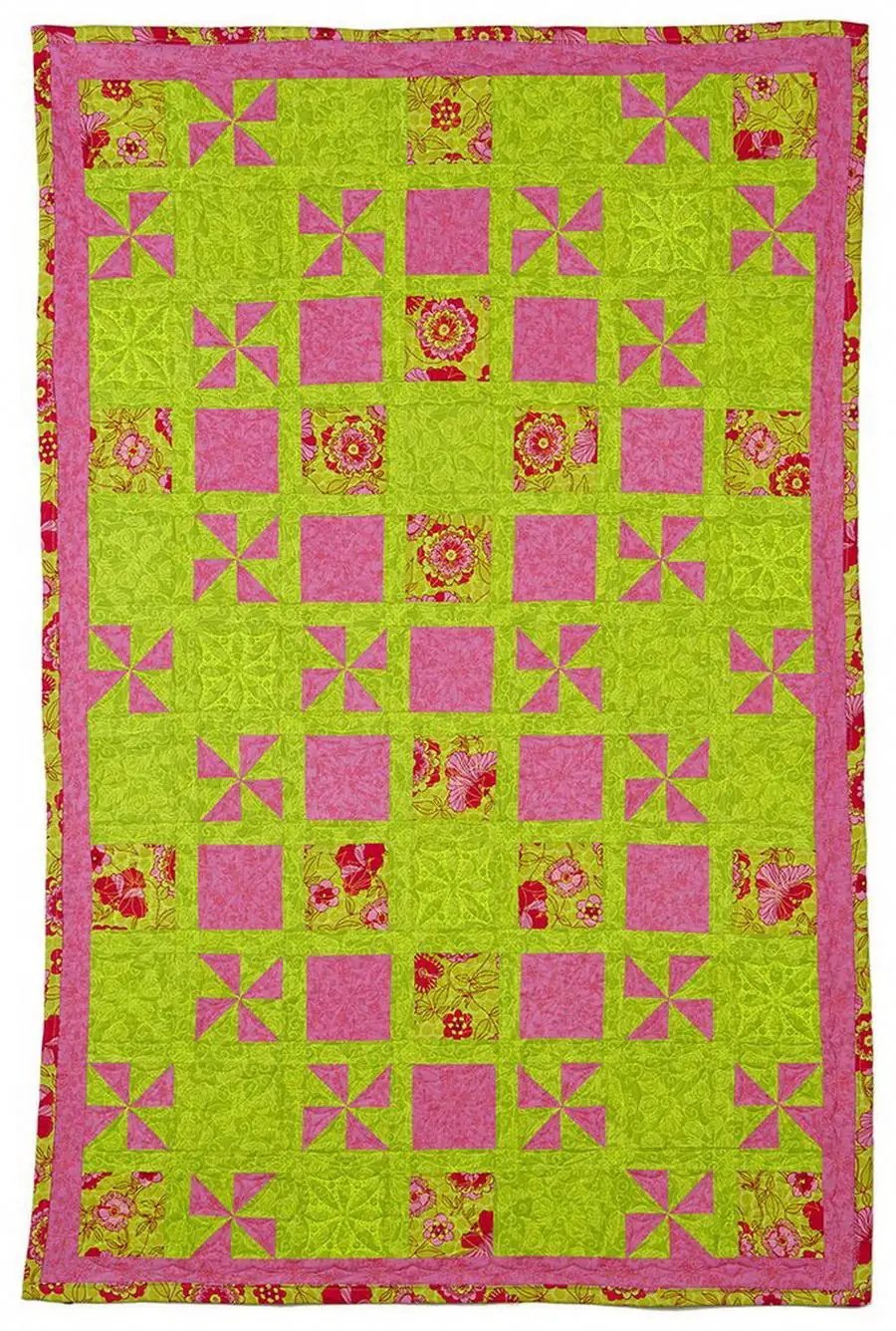 DIME Windmill Garden Quilt; lime green and pink windmill pinwheel blocks with floral prints and pink border.