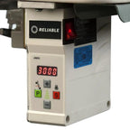 Reliable serger control panel; beige unit with red LED display and green P button.