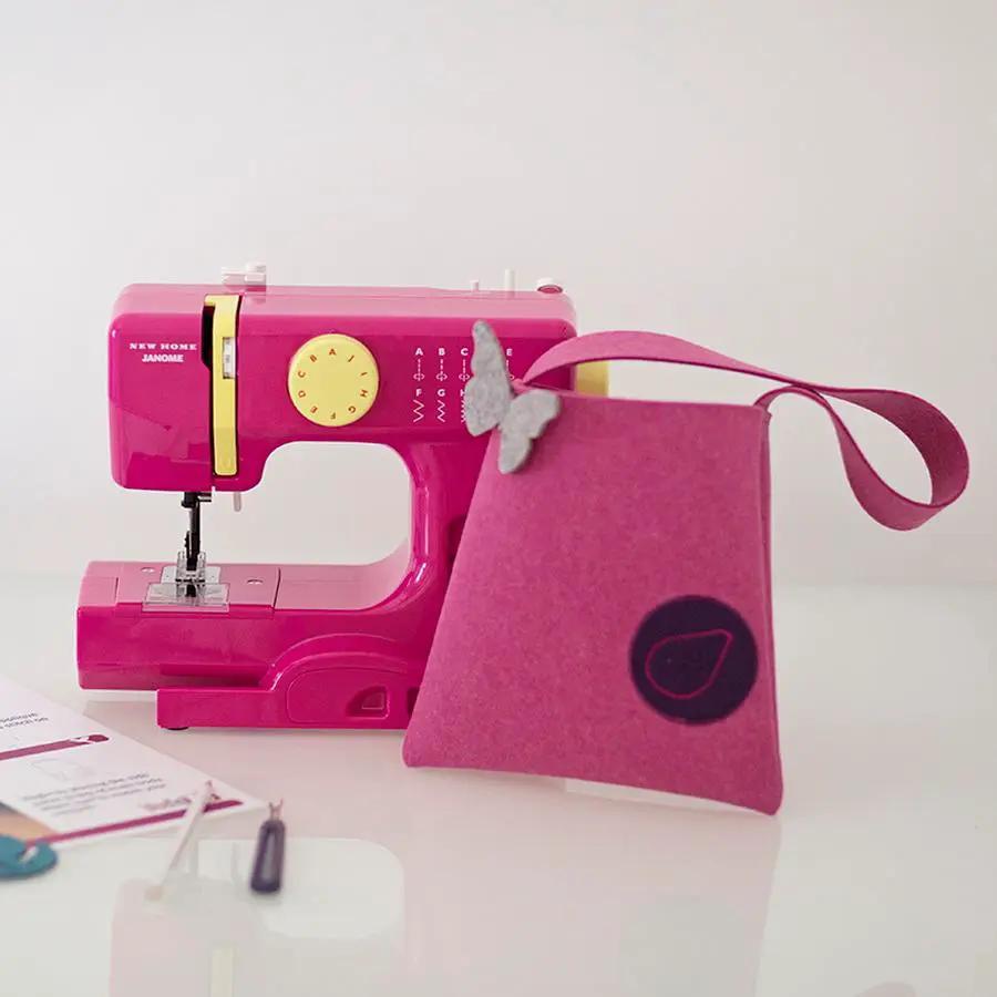 Bluefig Lil Purse Class 100 fabric kit featuring two pink items: a mini sewing machine and pink felt purse