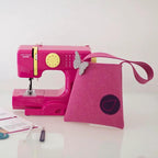 Bluefig Lil Purse Class 100 fabric kit featuring two pink items: a mini sewing machine and pink felt purse