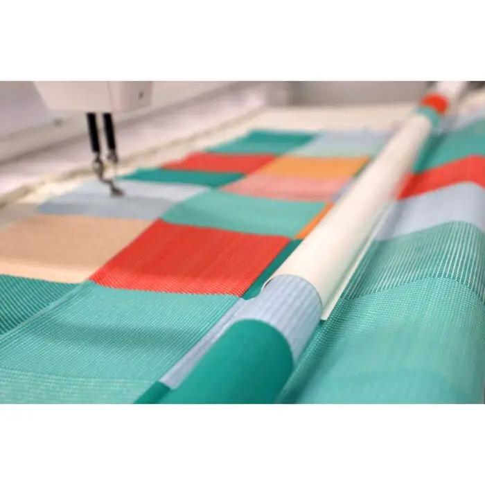 Handi Quilter Super Clamp Kit, Gallery (2) quilting clamps on teal quilt fabric