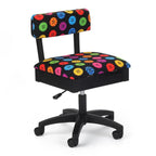 Kangaroo Sewing Furniture chair with colorful button-pattern upholstery on a black wheeled base