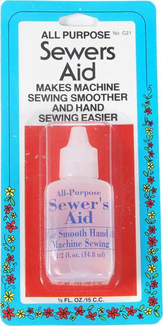 Collins Sewers Aid all-purpose silicone thread treatment bottle in pink, set in blue packaging