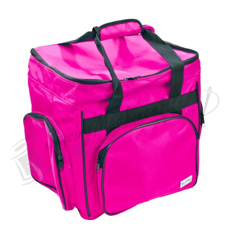 Tutto Serger/Accessory Bag in pink with black handles and multiple zippered pockets.