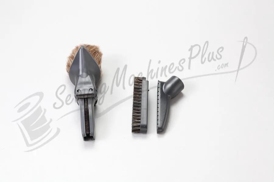The Bank Vault Canister Vacuum attachment trio: crevice tool, upholstery brush, and dusting brush.