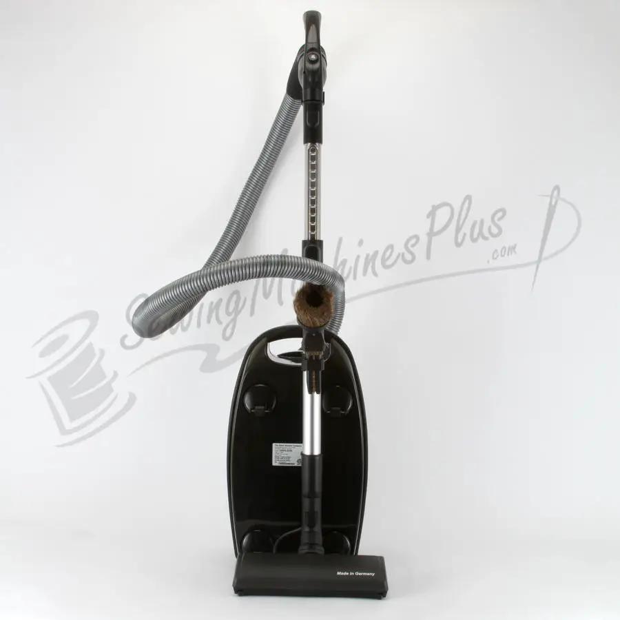 The Bank Vault Canister Vacuum, black canister with metal wand and grey hose