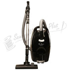 The Bank Vault canister vacuum in black with metal wand and flexible hose